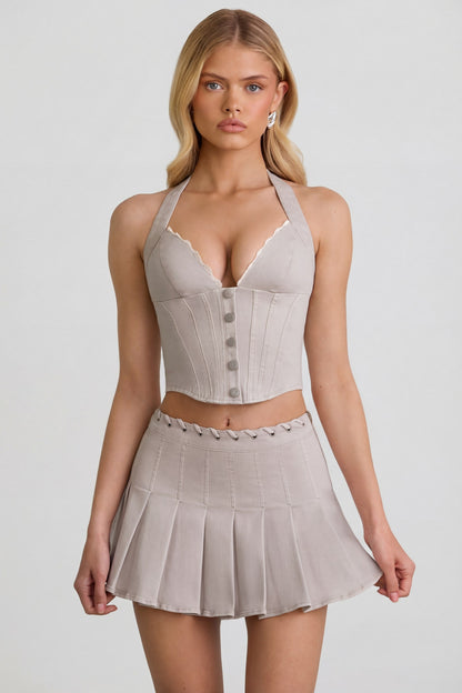 Low-Rise Pleated Mini Skirt in Ecru